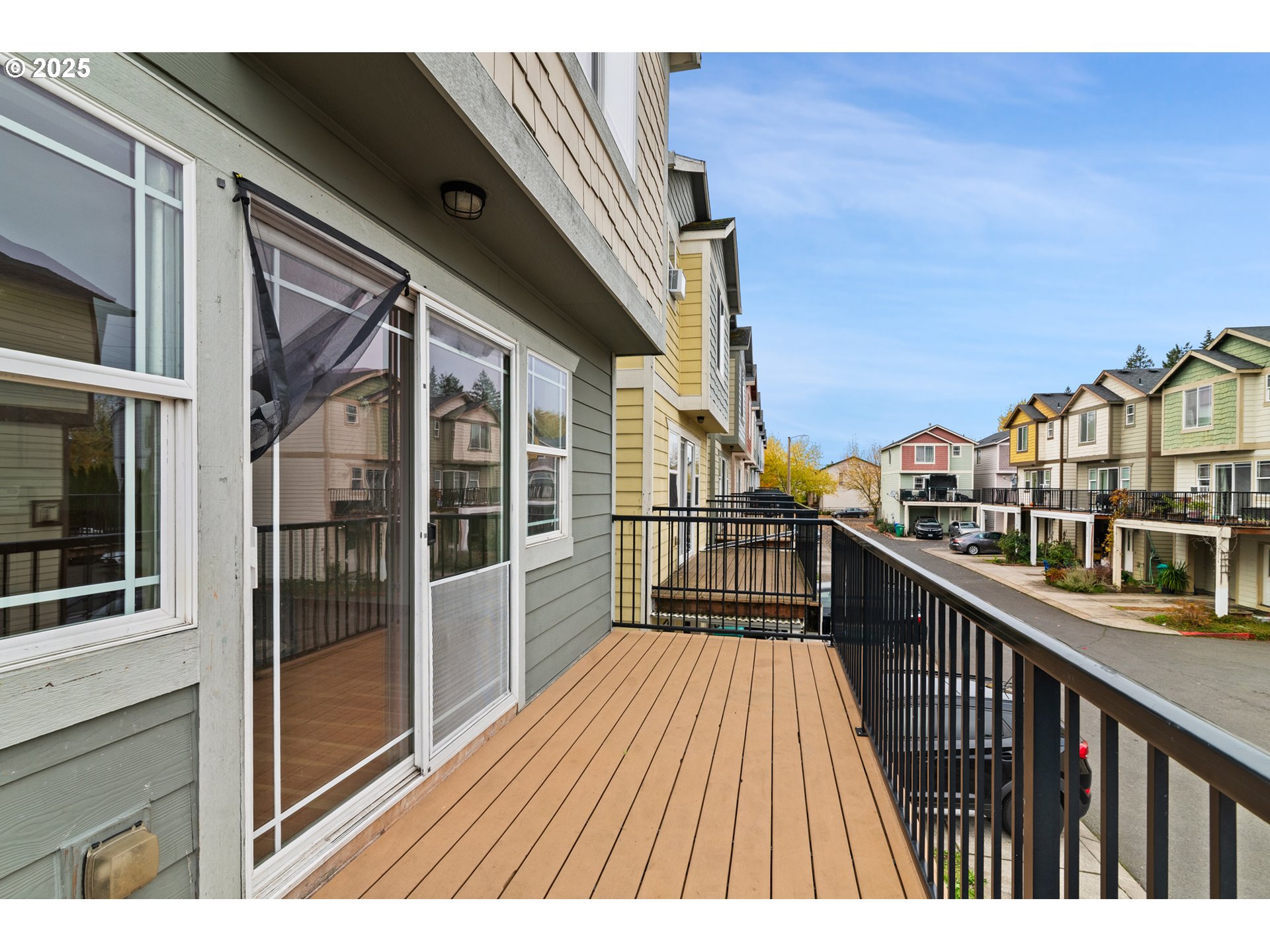 2518 Southeast 130th Avenue, Unit 5 Portland, OR 97236 - Photo 9 of 13 a view of balcony with wooden floor and fence