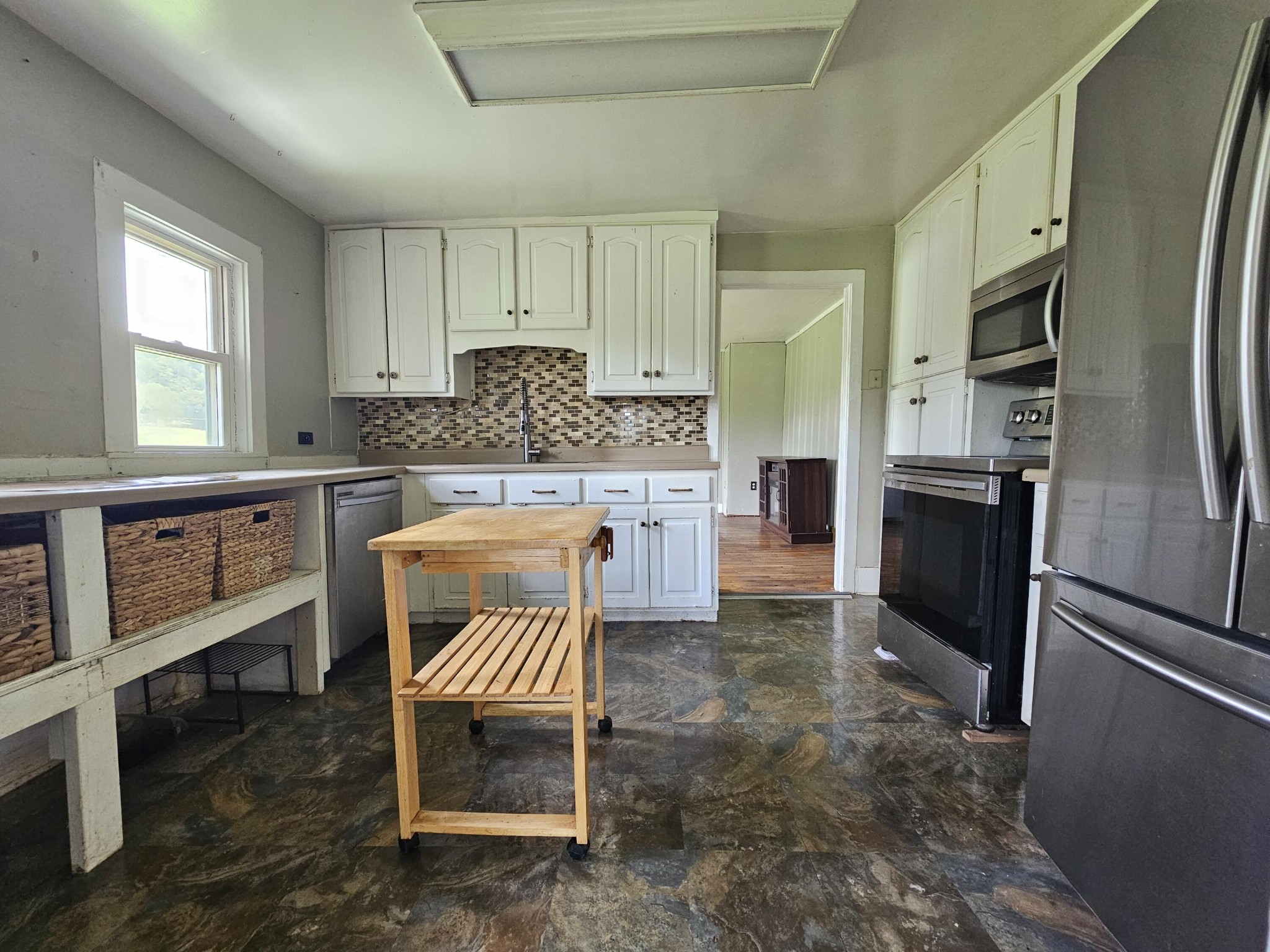 2783 No Pone Road Northwest Georgetown, TN 37336 - Photo 12 of 22 a kitchen with a refrigerator and a stove top oven