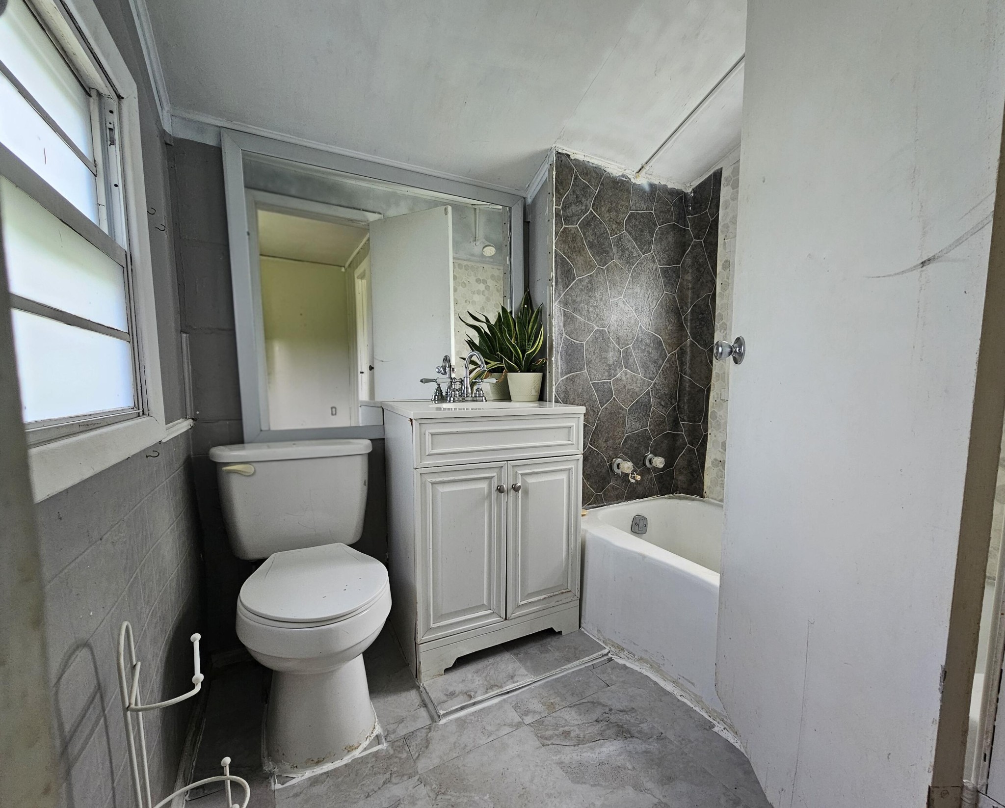 2783 No Pone Road Northwest Georgetown, TN 37336 - Photo 15 of 22 a white toilet sitting next to a bathroom sink