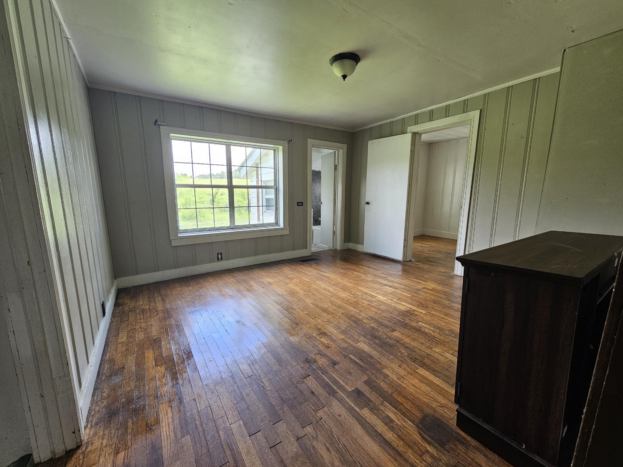 2783 No Pone Road Northwest Georgetown, TN 37336 - Photo 8 of 22 a view of an empty room with wooden floor and a window