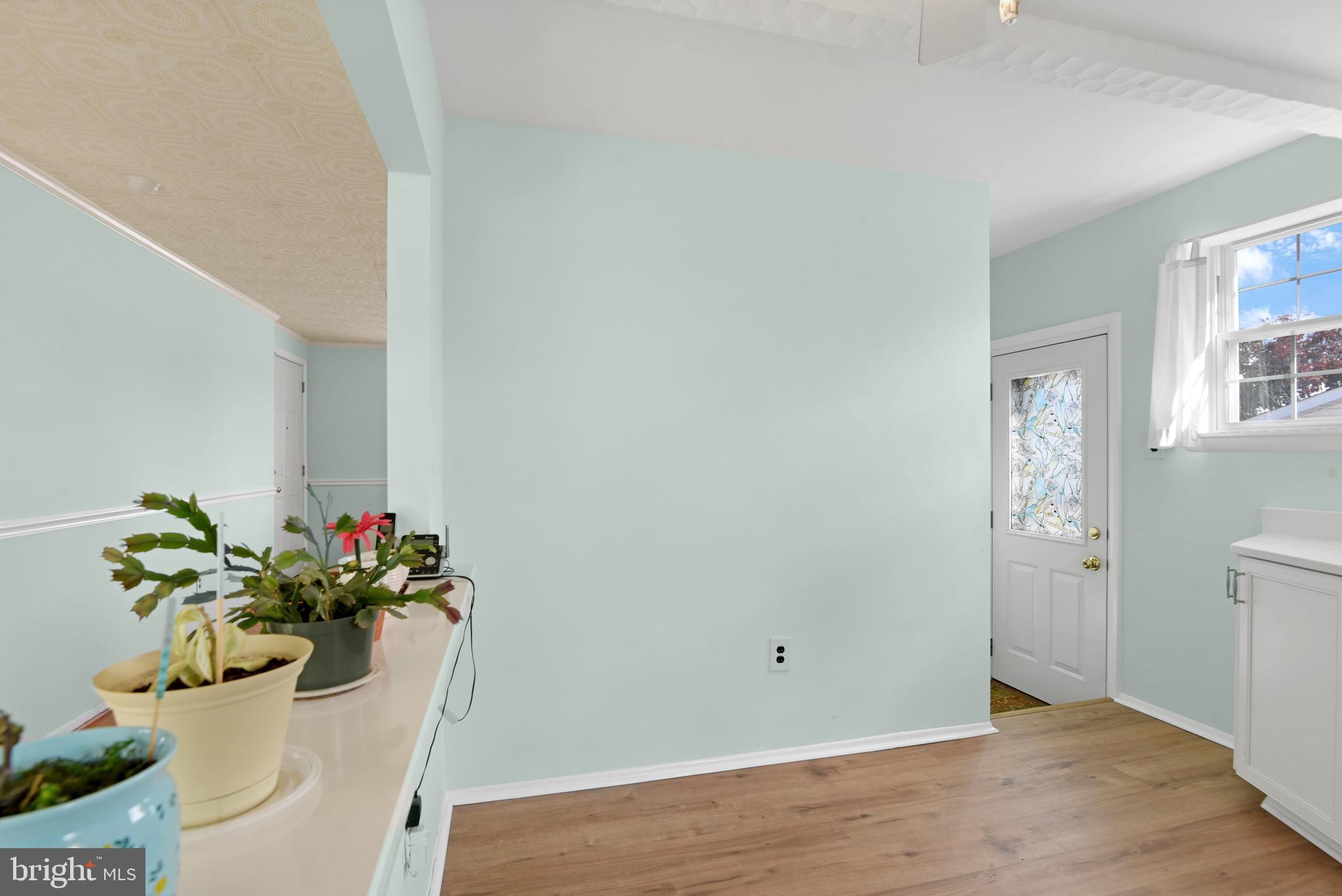 9641 Dundawan Road Baltimore, MD 21236 - Photo 14 of 37 a view of a white room with wooden floor
