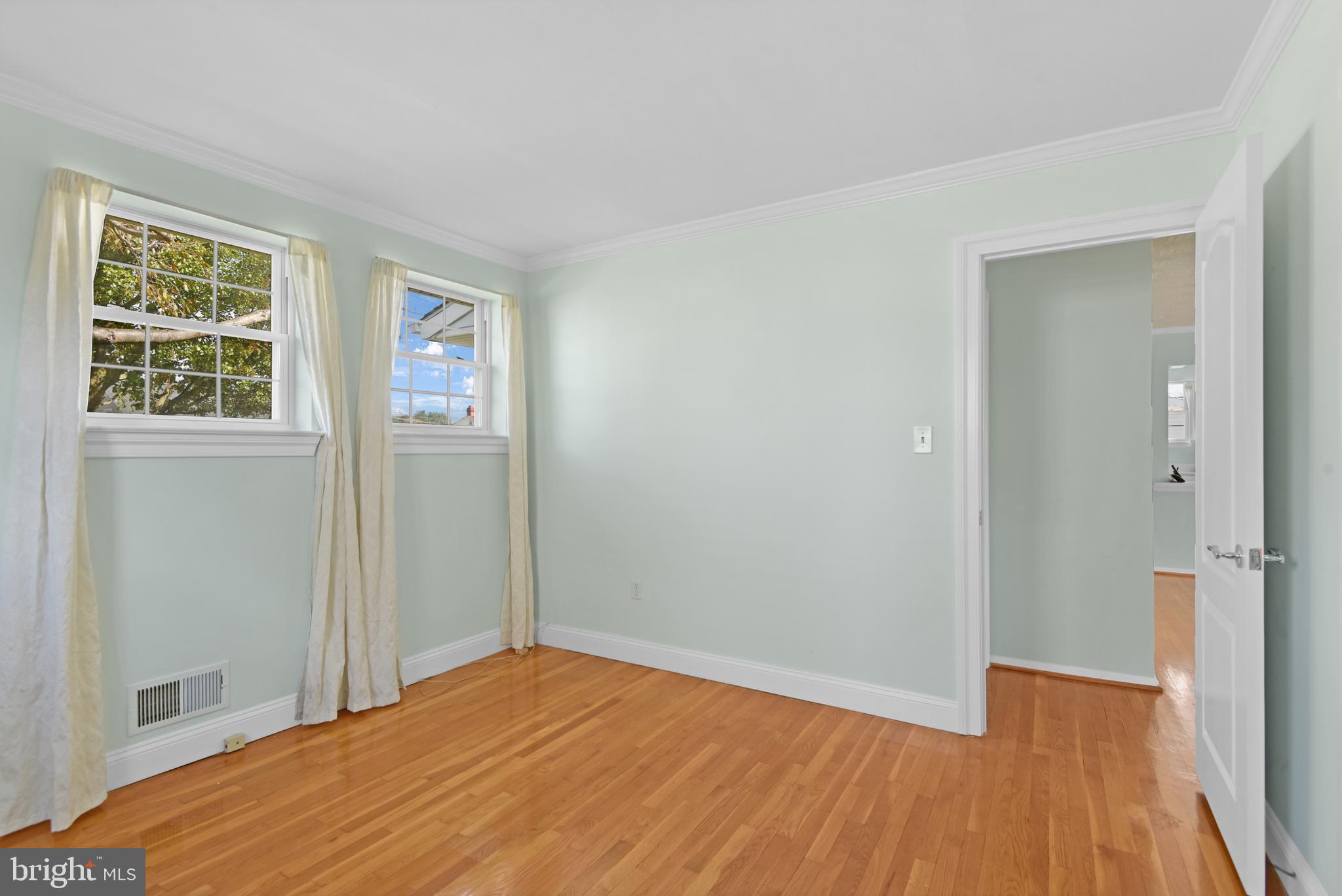 9641 Dundawan Road Baltimore, MD 21236 - Photo 15 of 37 a view of a room with wooden floor and windows