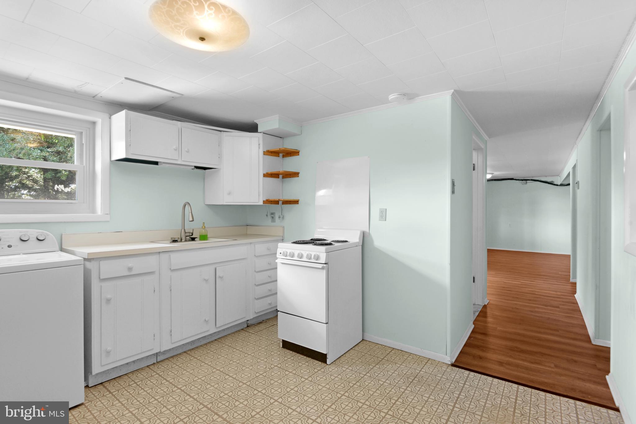 9641 Dundawan Road Baltimore, MD 21236 - Photo 22 of 37 a kitchen with a sink dishwasher a refrigerator and a stove