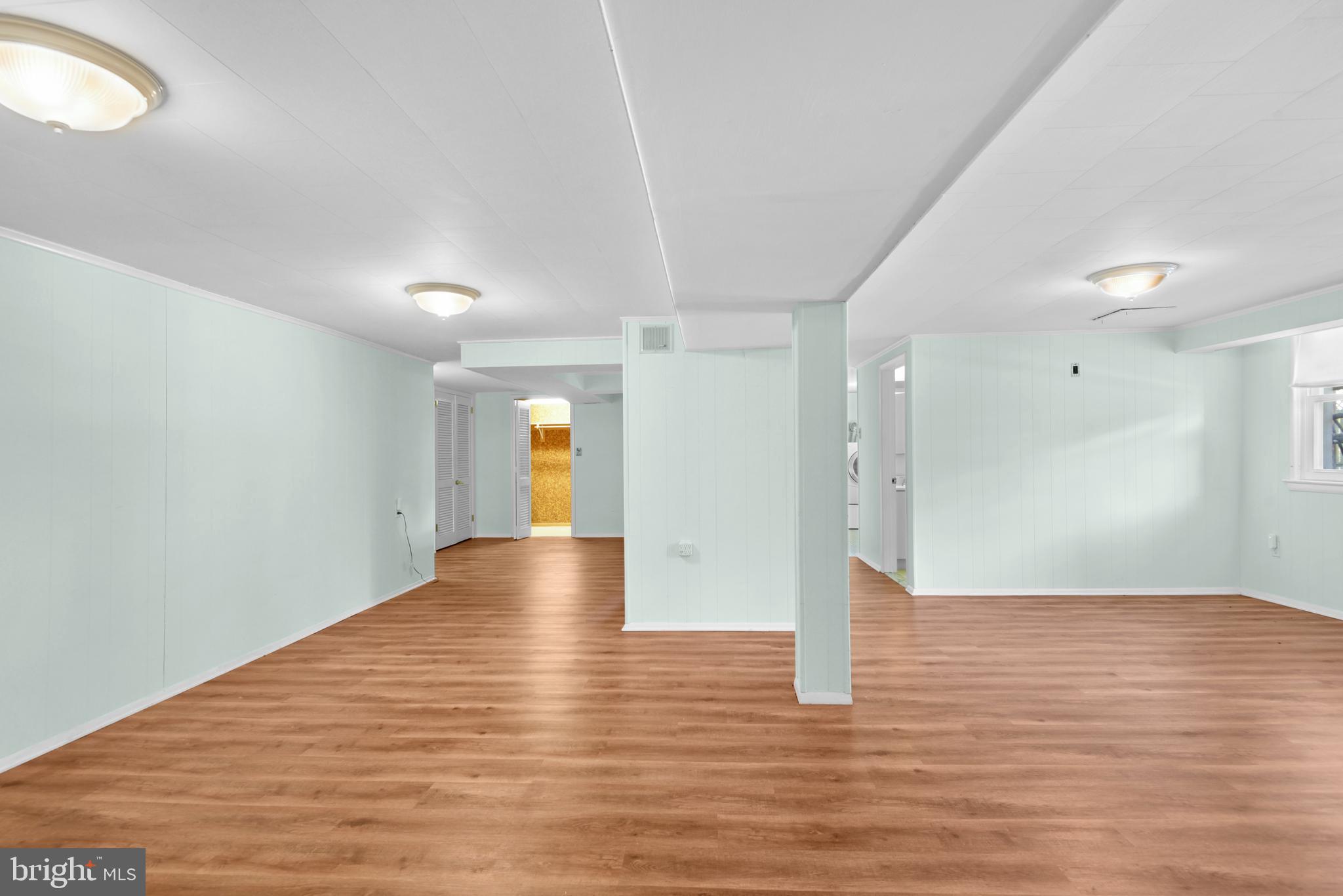 9641 Dundawan Road Baltimore, MD 21236 - Photo 24 of 37 a view of empty room with wooden floor