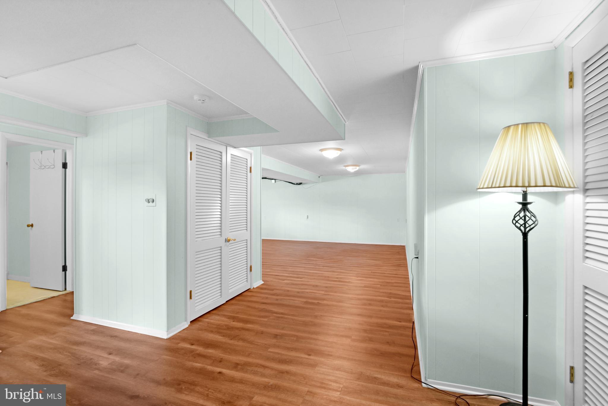 9641 Dundawan Road Baltimore, MD 21236 - Photo 27 of 37 a view of a hallway with wooden floor