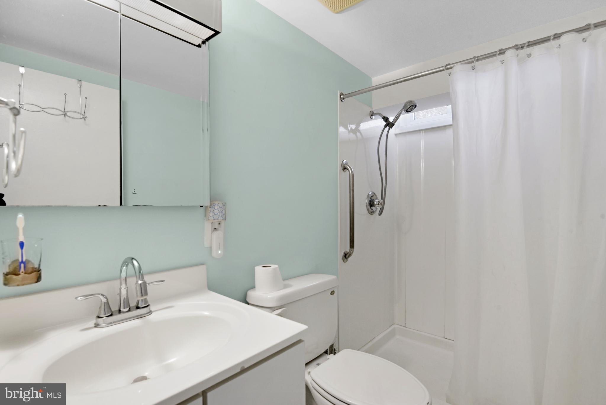 9641 Dundawan Road Baltimore, MD 21236 - Photo 28 of 37 a bathroom with a sink toilet and shower