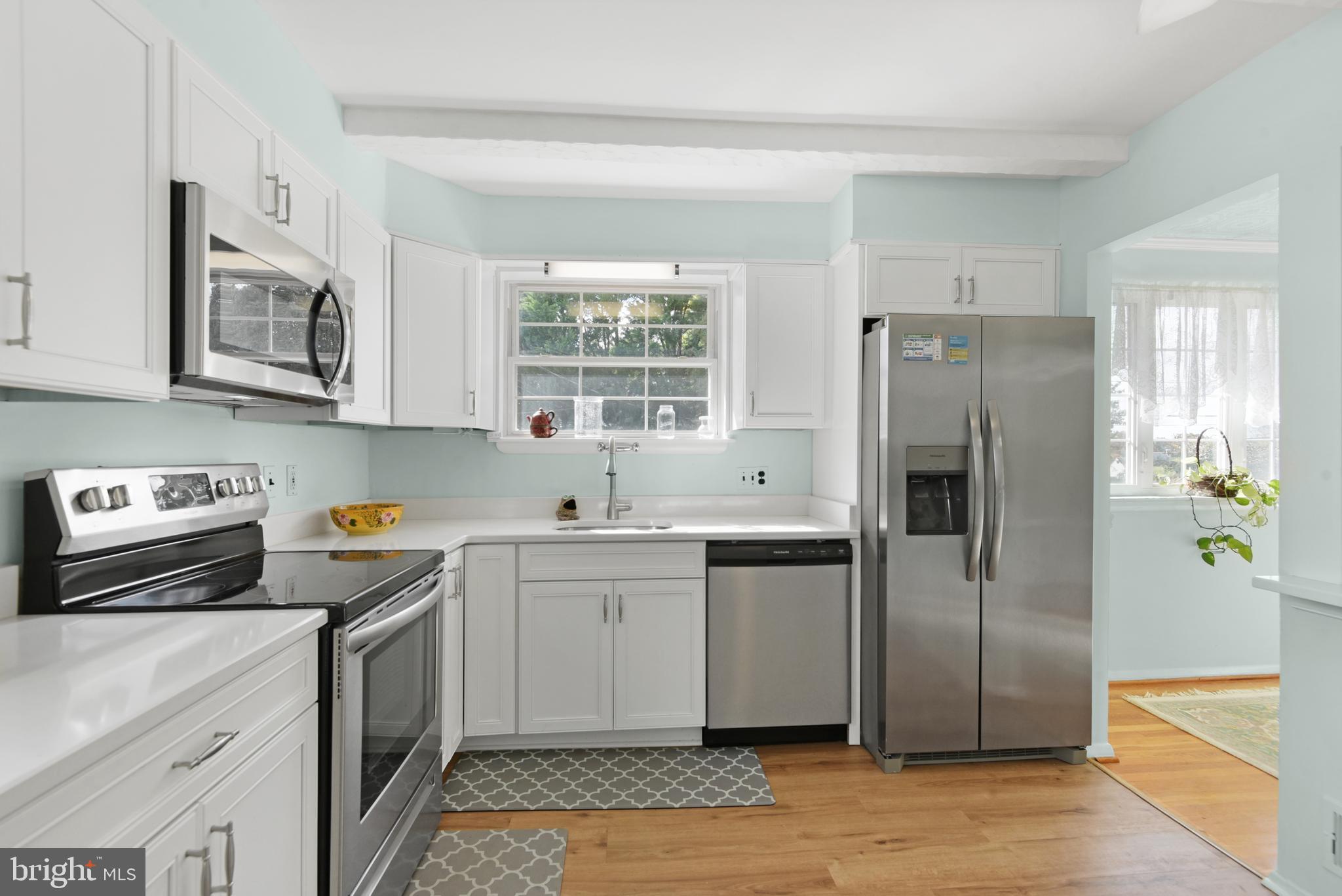 9641 Dundawan Road Baltimore, MD 21236 - Photo 4 of 37 a kitchen with stainless steel appliances granite countertop a refrigerator sink and stove