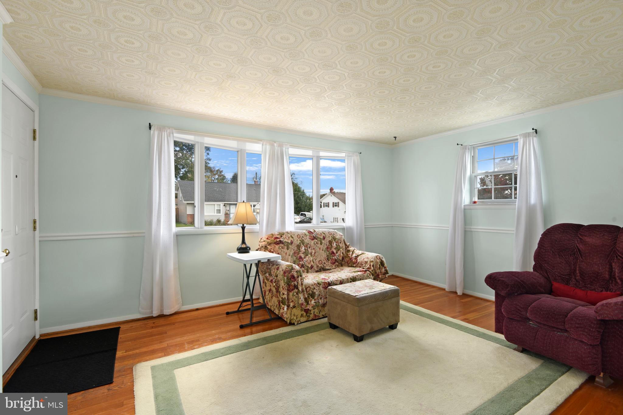 9641 Dundawan Road Baltimore, MD 21236 - Photo 7 of 37 a living room with furniture and a window