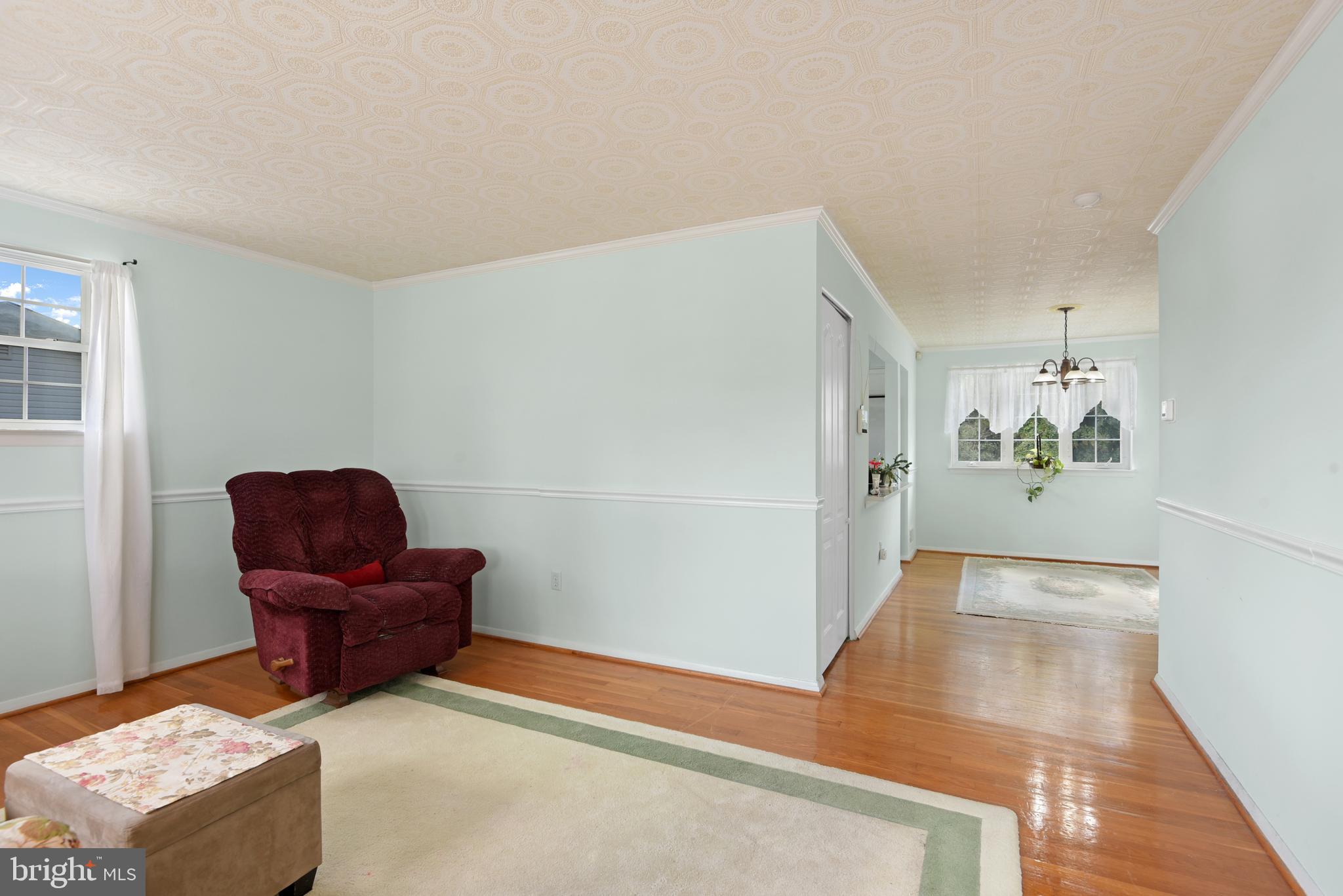 9641 Dundawan Road Baltimore, MD 21236 - Photo 8 of 37 a living room with furniture and a mirror