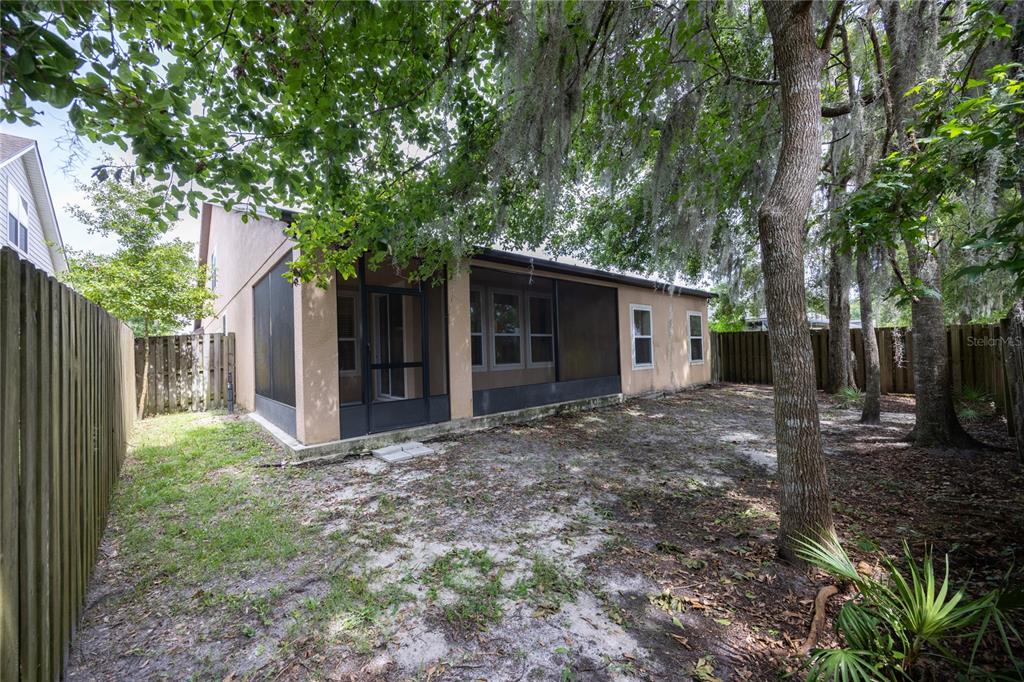 8216 Northwest 54th Street Gainesville, FL 32653 - Photo 55 of 58 a view of a house with a yard and large tree