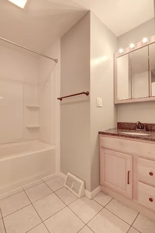 a bathroom with a bathtub and a sink