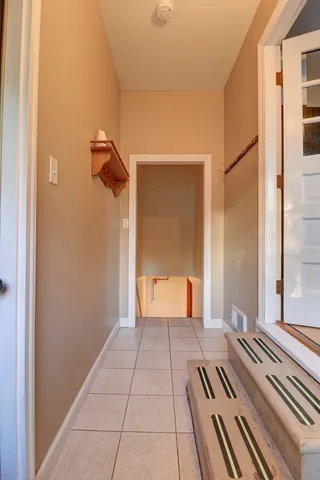 a view of a room with wooden walls