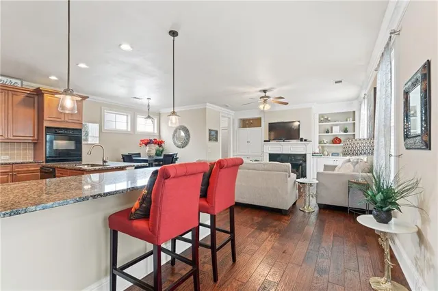a living room with fireplace furniture and a flat screen tv
