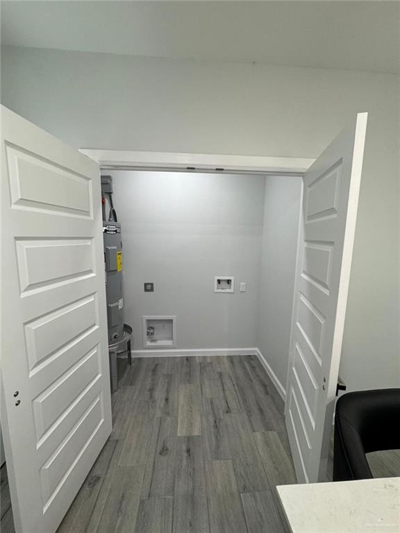 1704 Clinton Street, Unit 2 Harlingen, TX 78550 - Photo 5 of 13 a view of empty room with wooden floor and window
