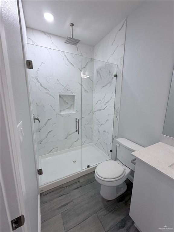 1704 Clinton Street, Unit 2 Harlingen, TX 78550 - Photo 10 of 13 a bathroom with a toilet and a shower