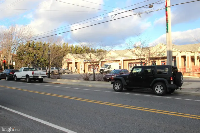 a view of street with parked cars