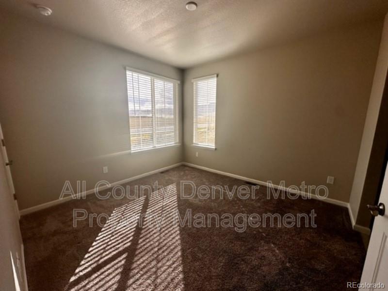 19580 West 92nd Drive, Unit E Arvada, CO 80007 - Photo 15 of 25 a view of a room with wooden floor