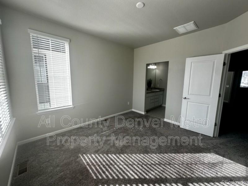 19580 West 92nd Drive, Unit E Arvada, CO 80007 - Photo 7 of 25 a view of an empty room with a window