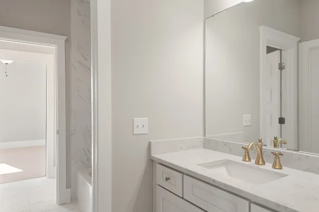 a dining room with furniture and a mirror