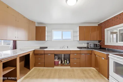 a kitchen with a sink and cabinets