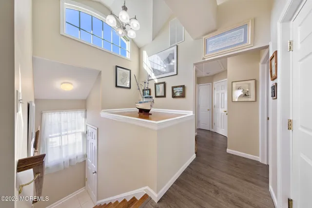 a kitchen with kitchen island granite countertop a large counter top appliances and cabinets