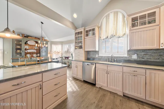 a view of a roof deck with table and chairs