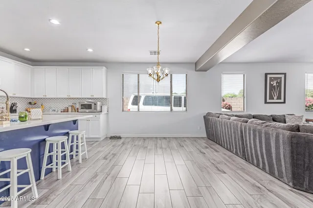 a kitchen with stainless steel appliances granite countertop a stove and a refrigerator