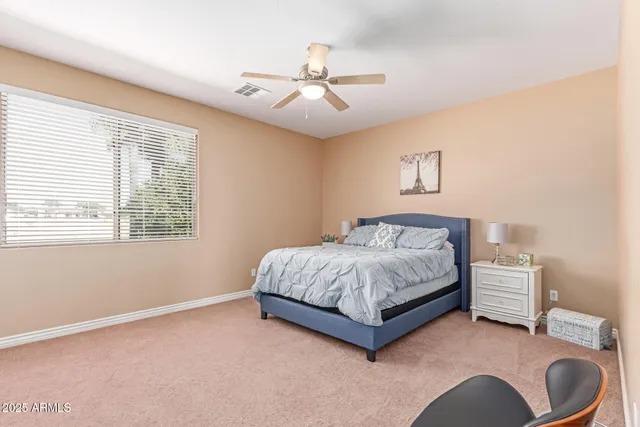 a view of room with guitars and wooden floor