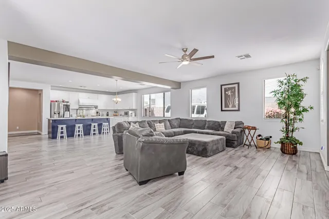 a view of kitchen with furniture window and wooden floor