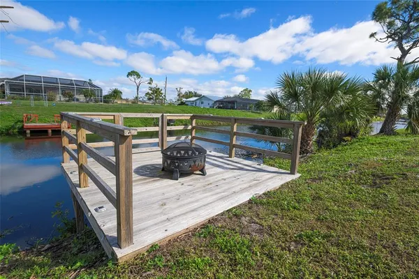 a view of a garden with wooden fence