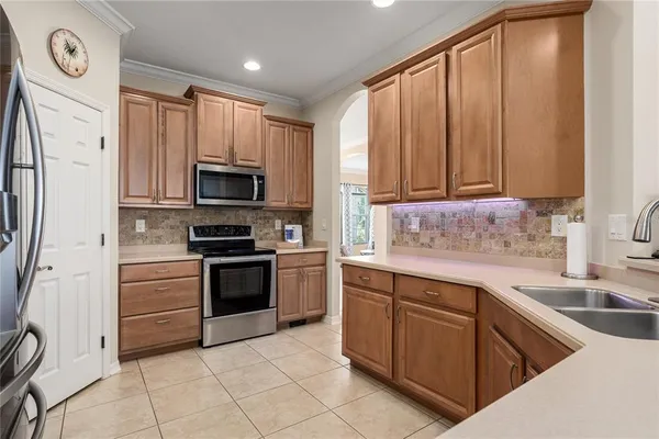 a kitchen with lots of counter top space and sink