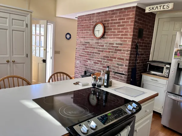 a kitchen with a stove and a table