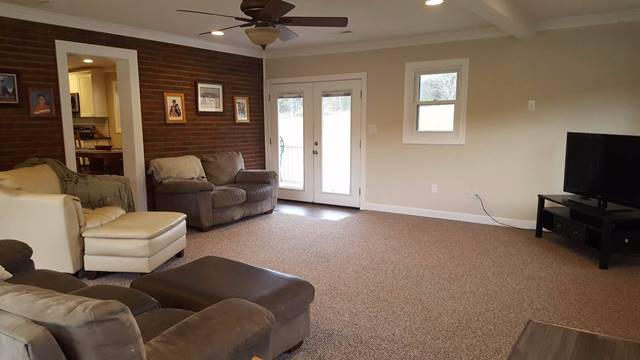 5115 Bethlehem Road Boones Mill, VA 24065 - Photo 14 of 42 a living room with furniture and a flat screen tv