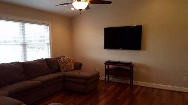 5115 Bethlehem Road Boones Mill, VA 24065 - Photo 23 of 42 a living room with furniture and a flat screen tv