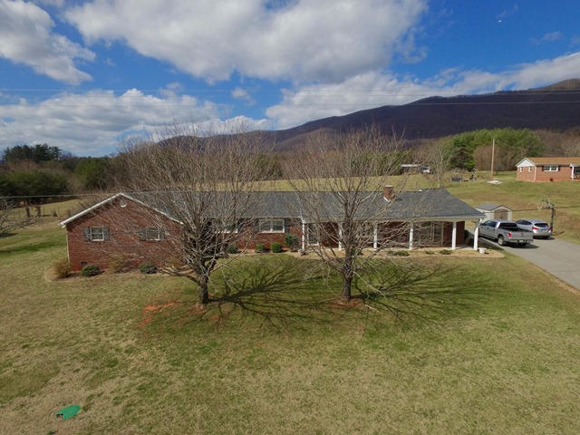 5115 Bethlehem Road Boones Mill, VA 24065 - Photo 4 of 42 a view of a big house with a big yard