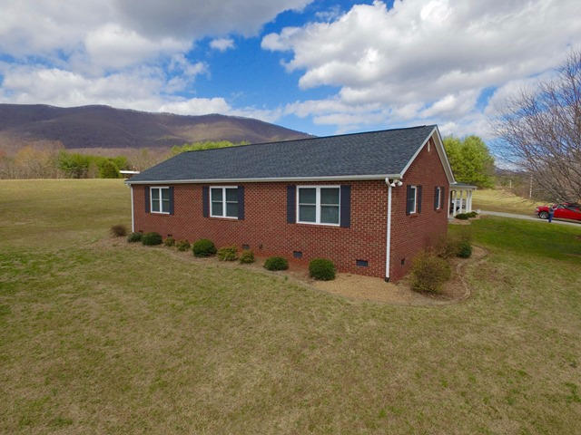 5115 Bethlehem Road Boones Mill, VA 24065 - Photo 36 of 42 a view of a house with a yard