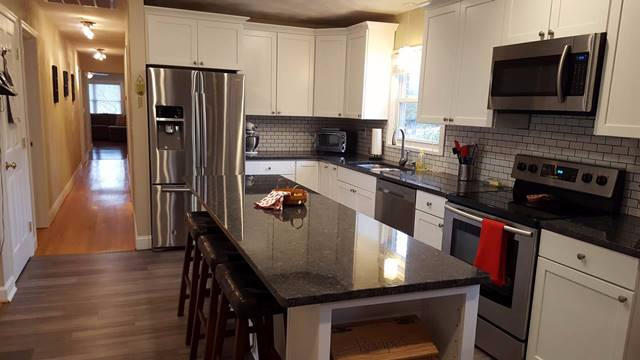 5115 Bethlehem Road Boones Mill, VA 24065 - Photo 10 of 42 a kitchen with stainless steel appliances a refrigerator a stove a microwave a sink and cabinets