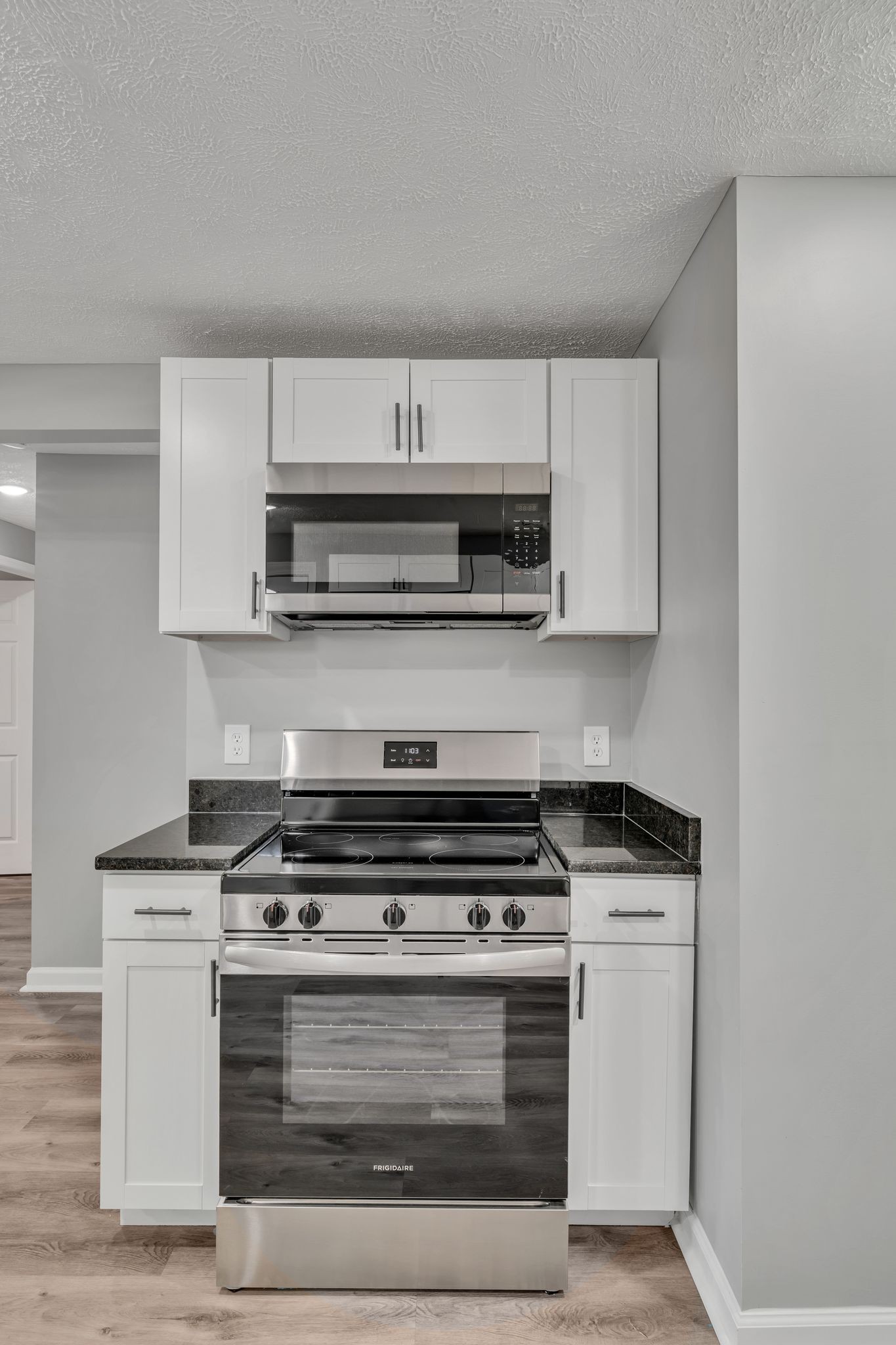 302 Maple Street Madison, TN 37115 - Photo 12 of 33 a stove top oven sitting inside of a kitchen