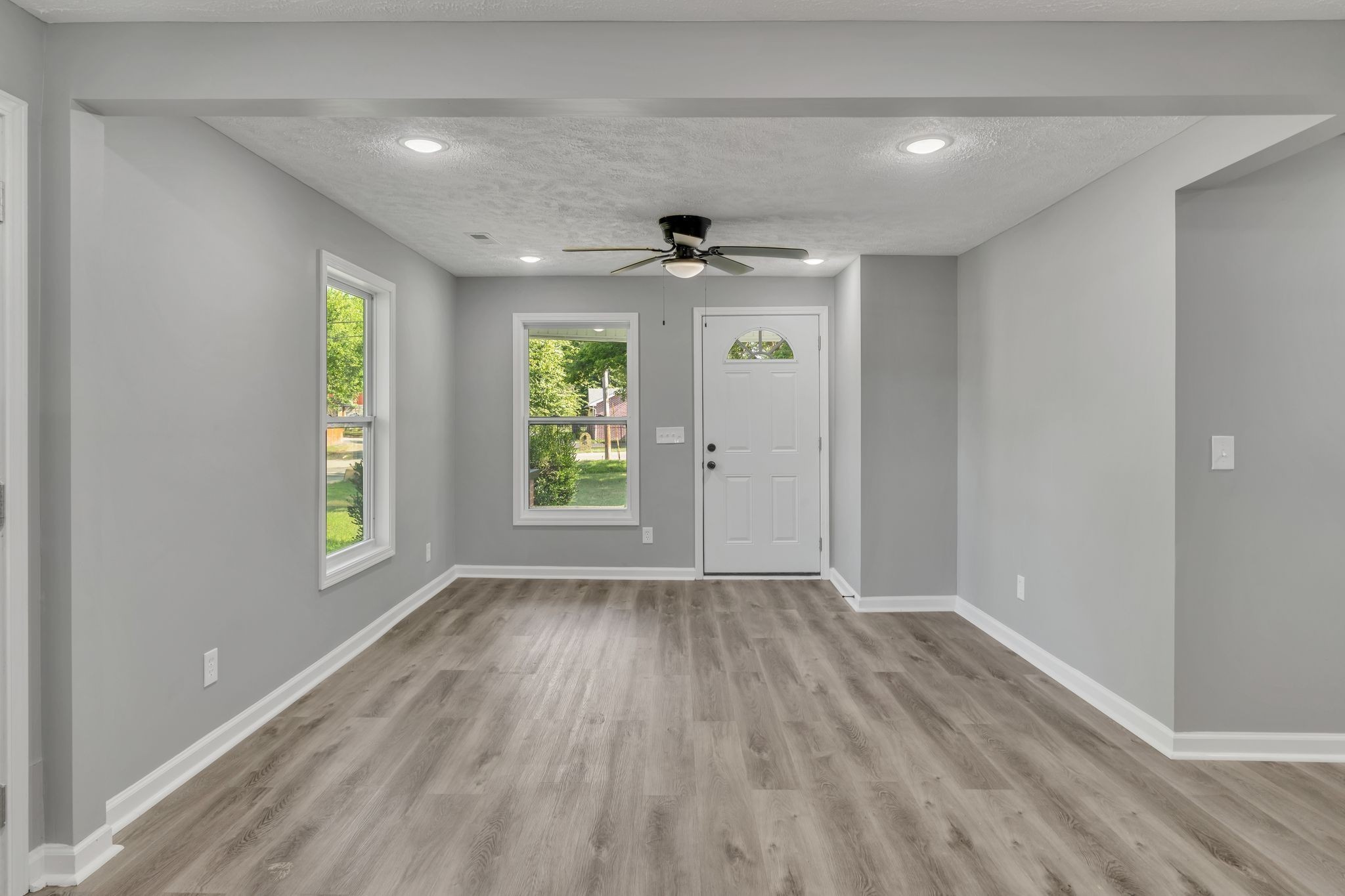 302 Maple Street Madison, TN 37115 - Photo 14 of 33 wooden floor in an empty room with a window