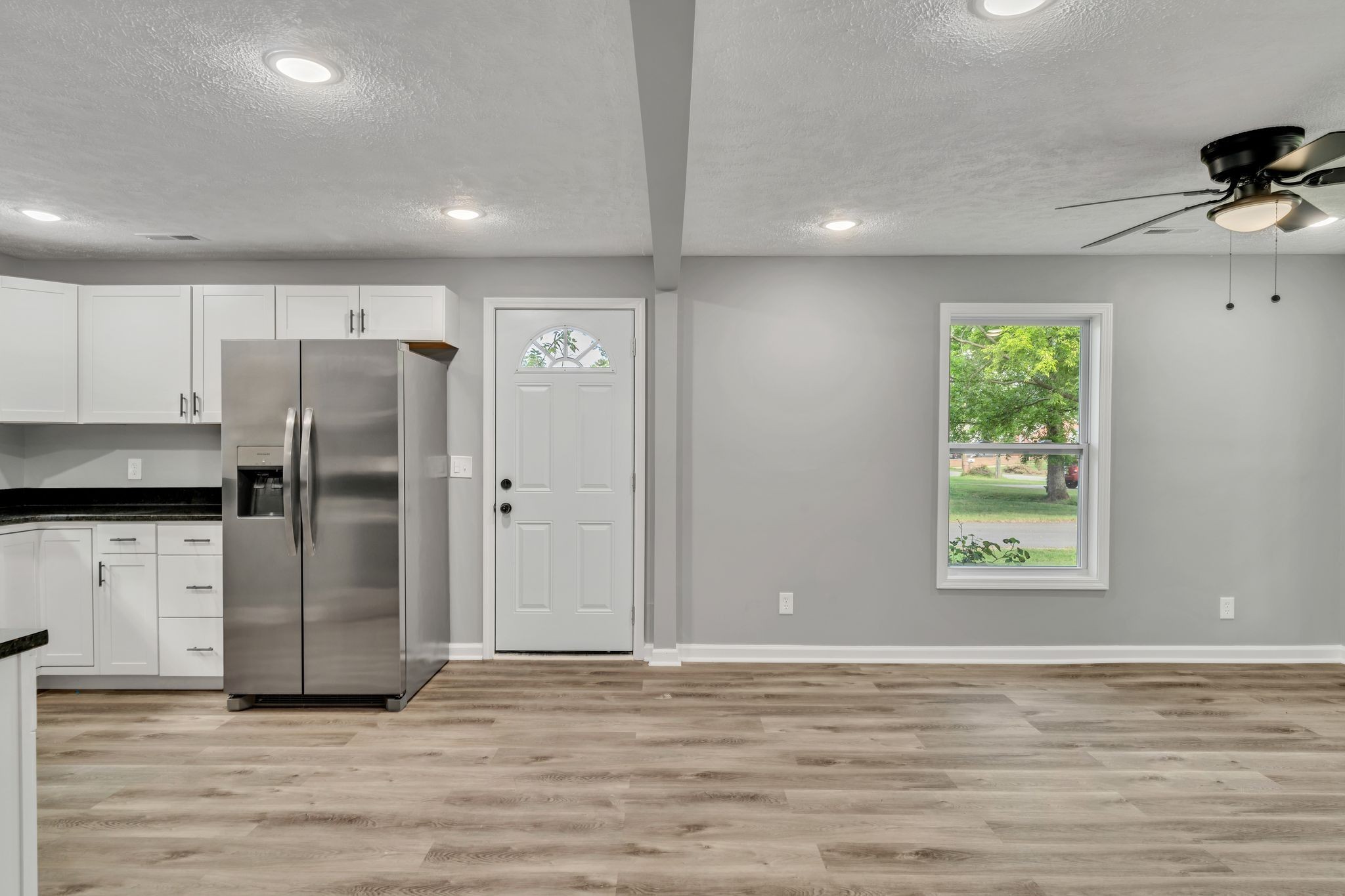 302 Maple Street Madison, TN 37115 - Photo 15 of 33 a view of a refrigerator in kitchen and wooden floor