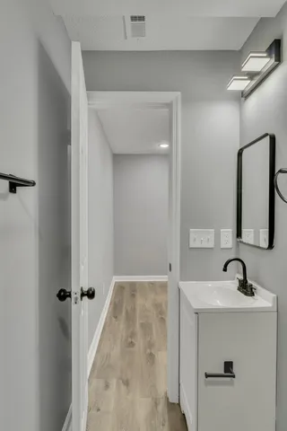 a bathroom with a sink and a mirror