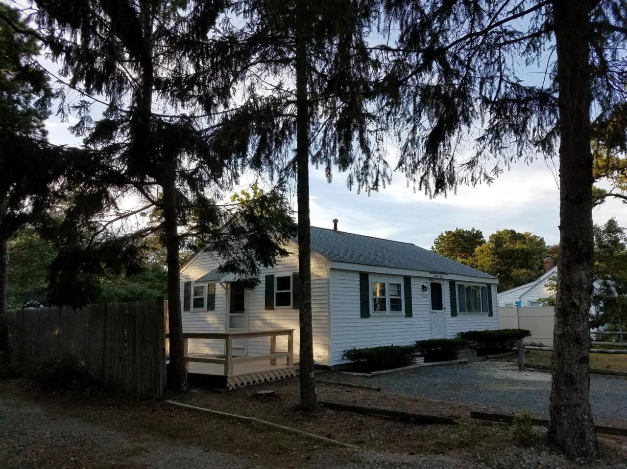 27 Glendon Road Dennis Port, MA 02639 - Photo 1 of 2 a house with trees in front of it