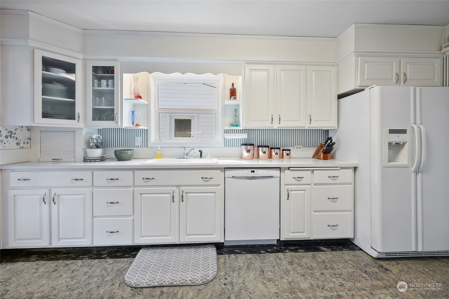 10337 184th Avenue Southwest Rochester, WA 98579 - Photo 8 of 32 a kitchen with white cabinets and white appliances