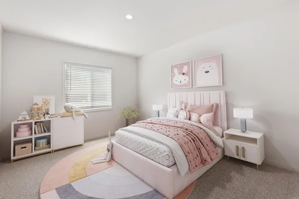 a bedroom with a bed and a couch with window