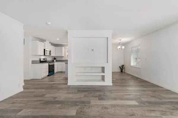 a view of a kitchen cabinets and wooden floor