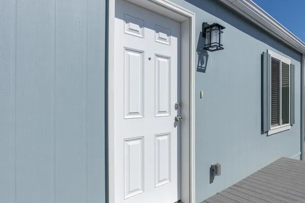 a view of a house with backyard and stairs
