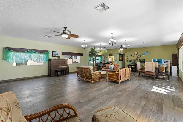 a living room with a table and a potted plant