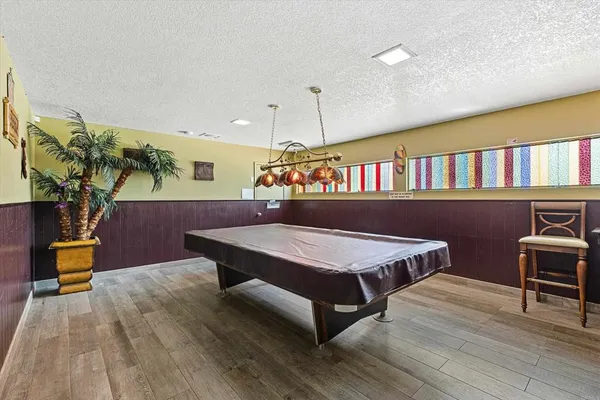 a dining room with furniture water view and a fireplace