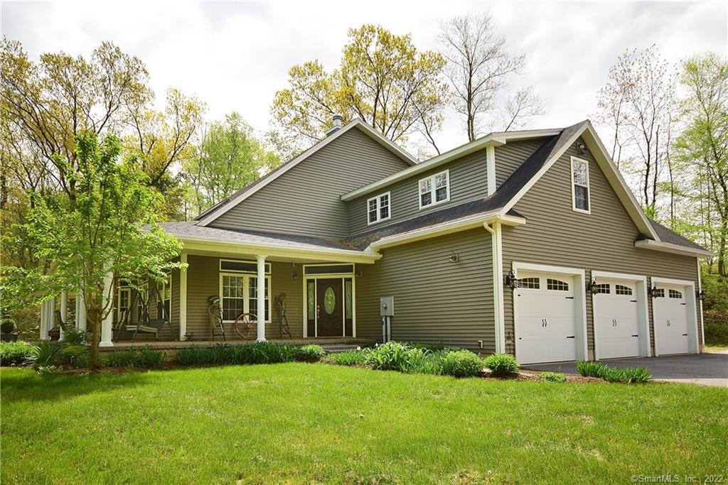 6 Broad Brook Road Ellington, CT 06029 - Photo 1 of 1 Exterior showing the attached 3 car heated garage, the covered 80' x 10' wrap-a-round porch, as well as the front door. Note the beautiful plantings.