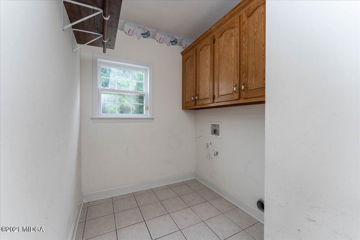 7455 Columbus Road Lizella, GA 31052 - Photo 17 of 32 a view of room with washer and dryer